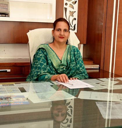 Paras Public School campus exterior with modern architecture and green playground